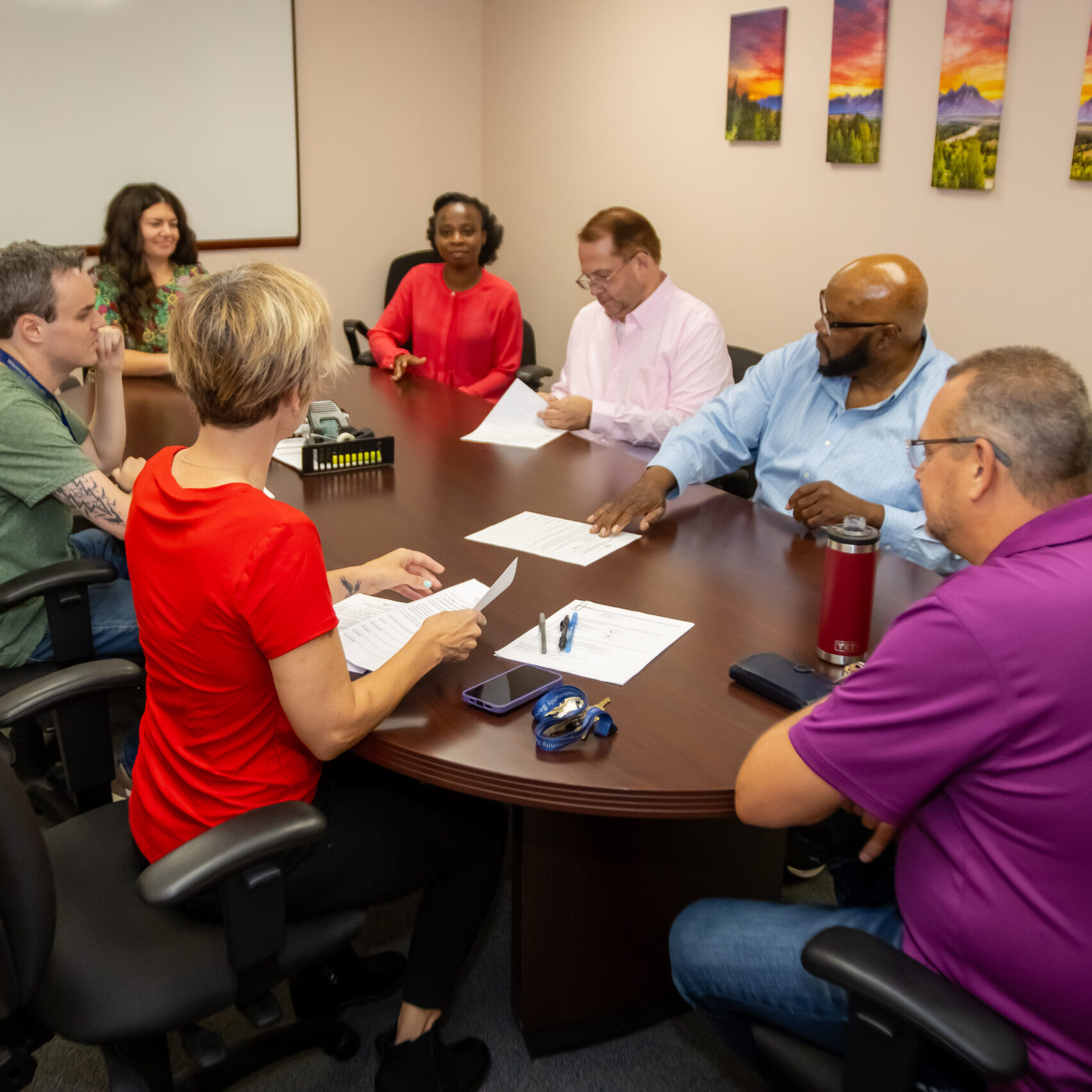 Group of people sitting around a table